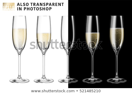 [[stock_photo]]: Engagement Ring In Glass Of Champagne