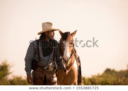 Stok fotoğraf: Boy Standing With Horse In Stable