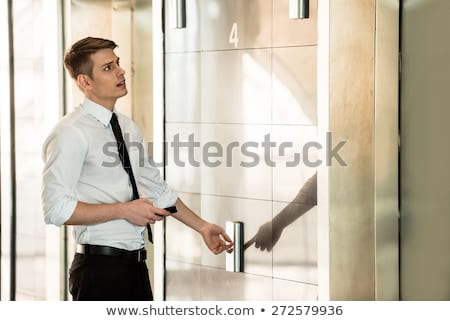 ストックフォト: Man Waiting For Elevator