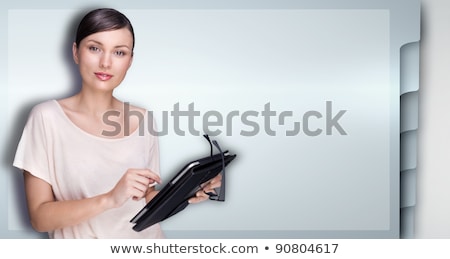 ストックフォト: Closeup Of Beautiful Woman With Electronic Tablet Against Web Si