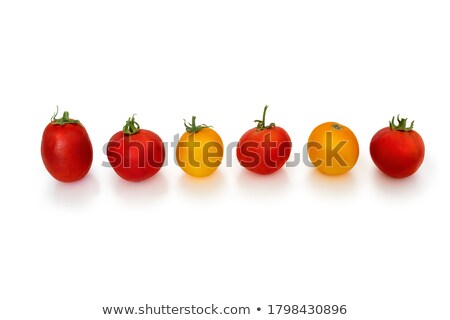 ストックフォト: Red Tomatoes Lined Up In A Row On A White Background