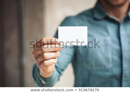 Foto stock: Business Man Showing A Blank Business Card