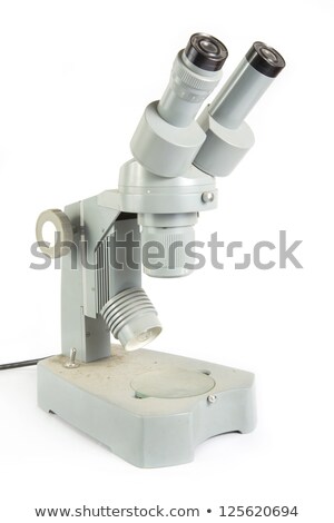 Foto d'archivio: Old Fashioned Dirty Microscope On White