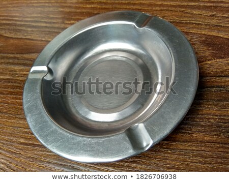 Stok fotoğraf: Cigarette In Metal Ashtray