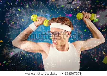 Stock fotó: Geeky Hipster Posing In Sportswear With Dumbbell