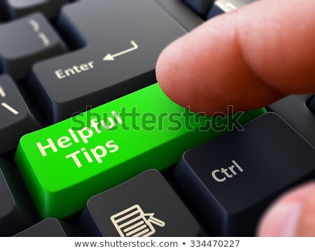 Stok fotoğraf: Pressing Green Button Helpful Tips On Black Keyboard