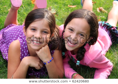 Two Cute Young Girls Relaxing Outdoors Foto d'archivio © gvictoria