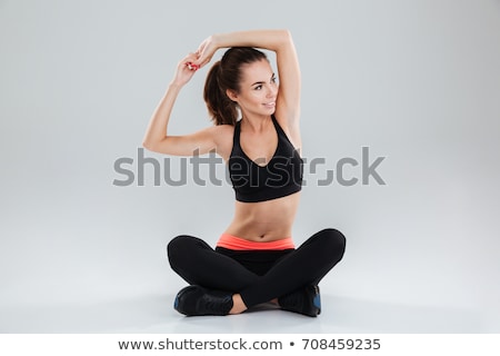 Сток-фото: Strong Young Fitness Woman Stretching Exercises