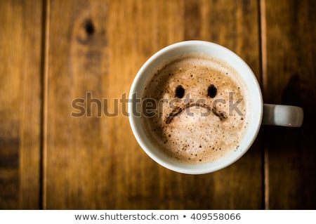 Stock photo: Cup Of Cappuccino With A Sad Face