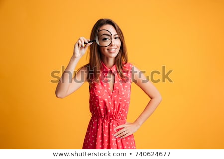 Stock fotó: Woman With Magnifying Glass