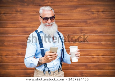 Older Man Outdoors With A Cellphone Stock foto © DisobeyArt