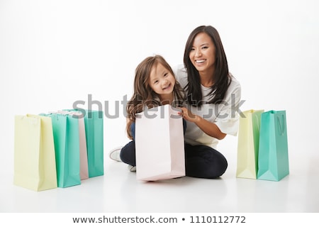 Stok fotoğraf: Mother And Daughter Shopping At The Market Together