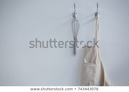 Stock fotó: Aprons Hanging On Hook