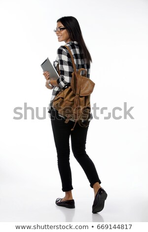 Stock fotó: Smiling Young Teenage Girl With Backpack Walking