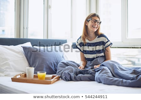 Stockfoto: A Beautiful Woman In Glasses With A Glass Of Coffee