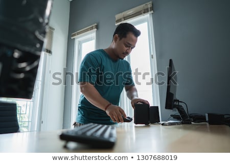 ストックフォト: Happy Technician Fixing A Computer