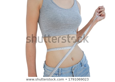 Stok fotoğraf: Woman Measuring Her Waist