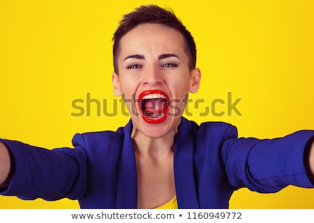 Сток-фото: Attractive Young Woman Scream Out Loud With Yellow Lipstick