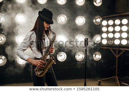 Foto stock: Attractive Woman With Saxophone