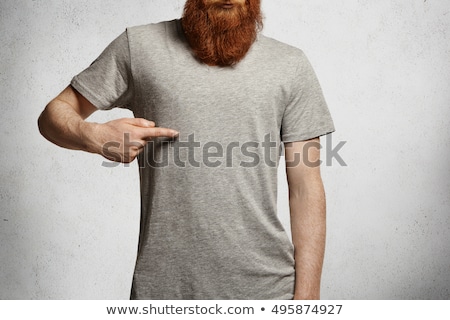 Foto stock: Smiling Man In T Shirt Pointing Fingers On Himself