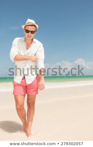 Foto stock: Full Body Picture Of A Young Man Fixing His Sleeve