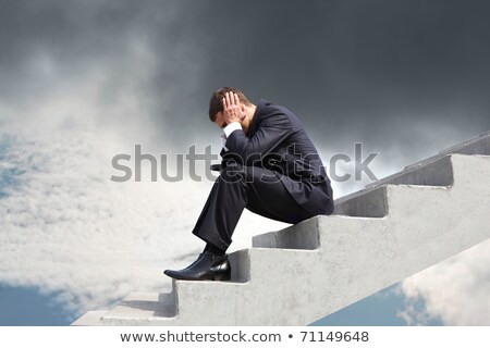 Zdjęcia stock: Depressed Businessman Sitting On Steps