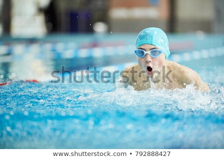 Boy In Swimming Cap And Goggles Stockfoto © Pressmaster