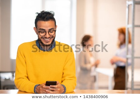 Stok fotoğraf: Positive Arabian Manager Texting Sms