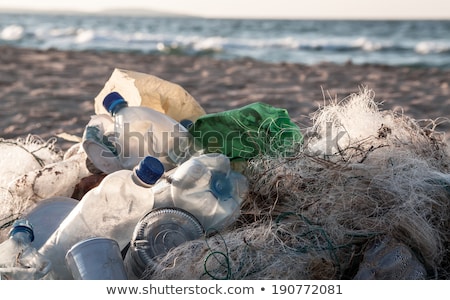 Stok fotoğraf: Beach Pollution Plastic Bottles And Other Trash On Sea Beach