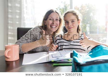 Stockfoto: Child Doing His Homework In The Witchen Table