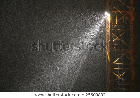 Zdjęcia stock: Snowfall In Beam Of Projector At Night