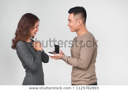 Сток-фото: Woman With Earrings Wedding Ring And Gift Box