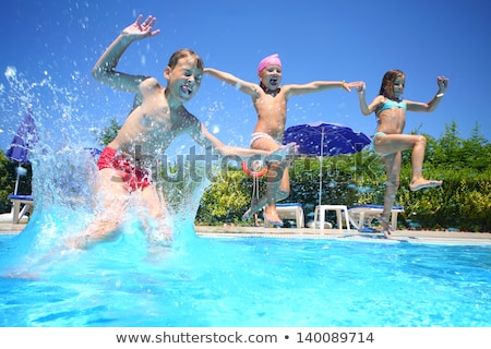 Stock photo: Two Friends Jumping In The Pool