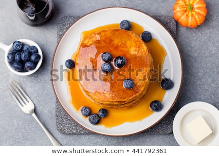 Stockfoto: Pumpkin Pancakes With Maple Syrup And Blueberries On A Plate Grey Stone Background Top View