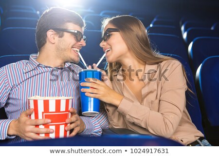 Foto d'archivio: Happy Couple Interacting In Theatre