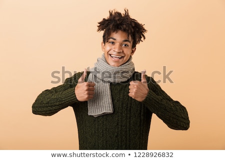 Foto d'archivio: Portrait Of Joyous African American Guy Wearing Sweater And Scar