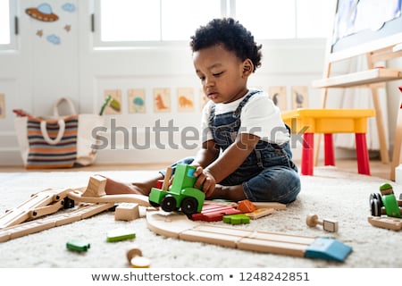 Stok fotoğraf: Children Play With Wooden Toy Build Toy Railroad At Home Or Daycare Toddler Boy Play With Crane T