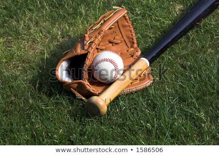 Foto stock: Leather Glove With Baseball And Bat Against Black Background