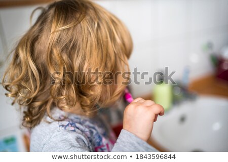 ストックフォト: Responsible Young Girl Brushing Her Teeth