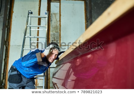 Stockfoto: Mature Man Checking Sails On Yacht