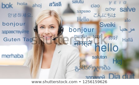 Foto stock: Woman In Headset Over Words In Foreign Languages