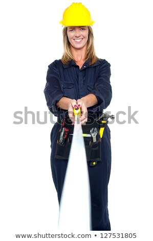 ストックフォト: Engineer Woman Stretching Measuring Tape