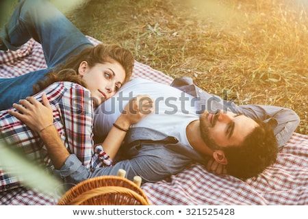 ストックフォト: Couple Lying On Summer Field