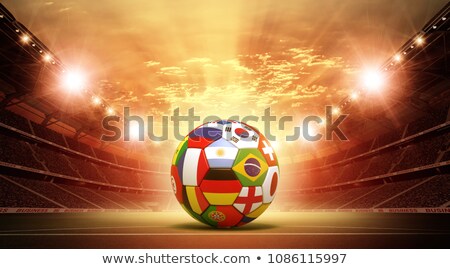 ストックフォト: Soccer Ball On Grass With Germany Flag