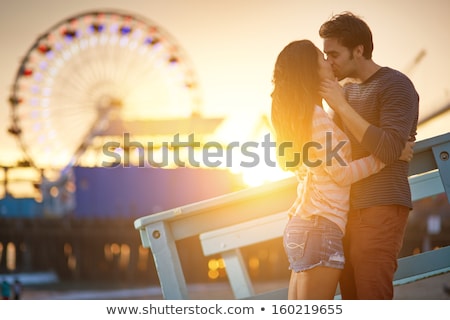 Stok fotoğraf: Romantic Young Couple Embracing On Beach