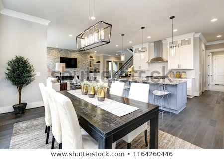 Stok fotoğraf: Beautiful Kitchen In Luxury Home Modern Interior With Island And Stainless Steel Chairs