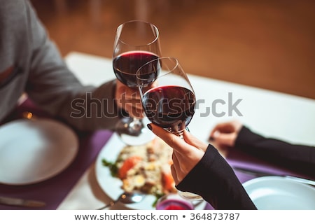 ストックフォト: Young Happy Couple On A Romantic Date Drinking Red Wine
