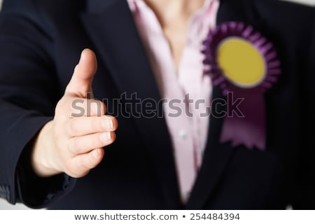 ストックフォト: Close Up Of Female Politician Reaching Out To Shake Hands