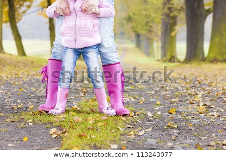 Сток-фото: Little Girl Wearing Rubber Boots In Autumnal Alley