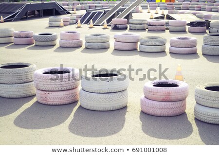 Foto stock: Old Tyres On The Racing Track